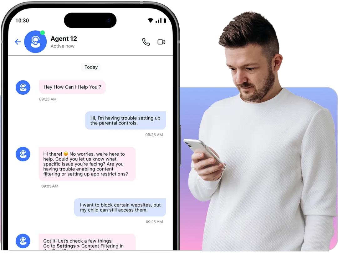 Man in white sweater using smartphone to engage in live chat support for parental control setup with OmniParent.