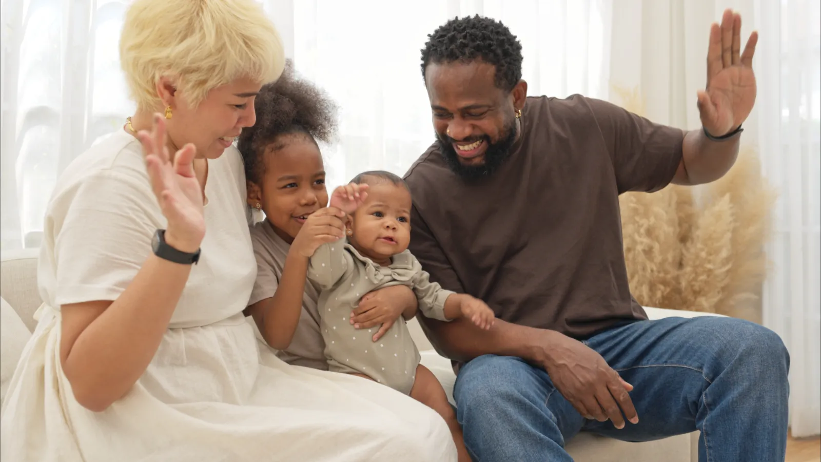 Family enjoying quality time together, smiling and waving, with a focus on child safety and connection in modern parenting.